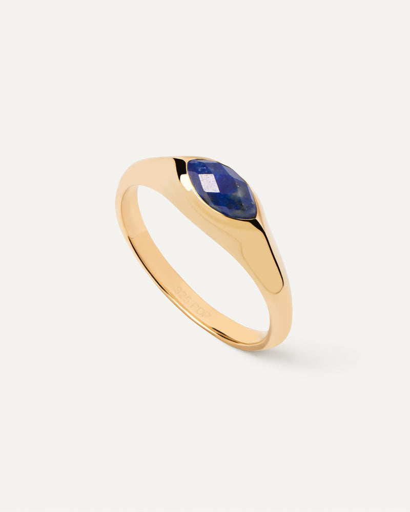 Gold-plated signet ring embellished with marquise cut blue gemstone