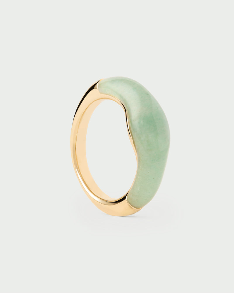 Gold-plated fluid stamp ring topped with a hand-carved green gemstone