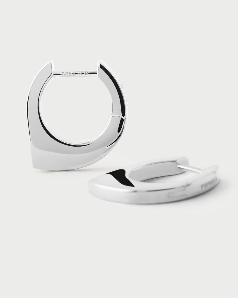 Silver geometric hoop earrings with asymmetric round shape