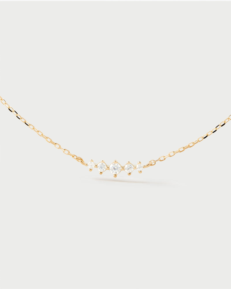 Elegant necklace set with a trail of five white zirconia