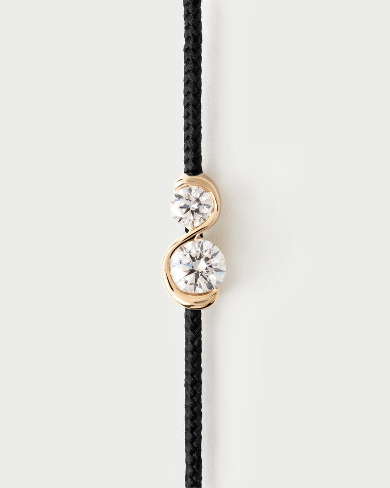 Adjustable diamond cord bracelet featuring two lab-grown diamonds