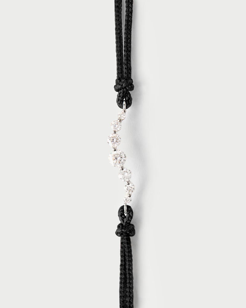 Adjustable diamond cord bracelet with a row of lab-grown diamonds in graduating sizes