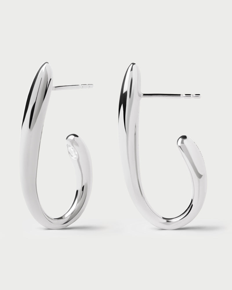 Silver modern semi hoops accented with a round white zirconia