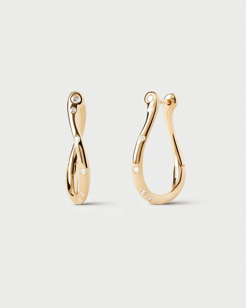 Small wavy hoop earrings adorned with sparkling zirconia accents