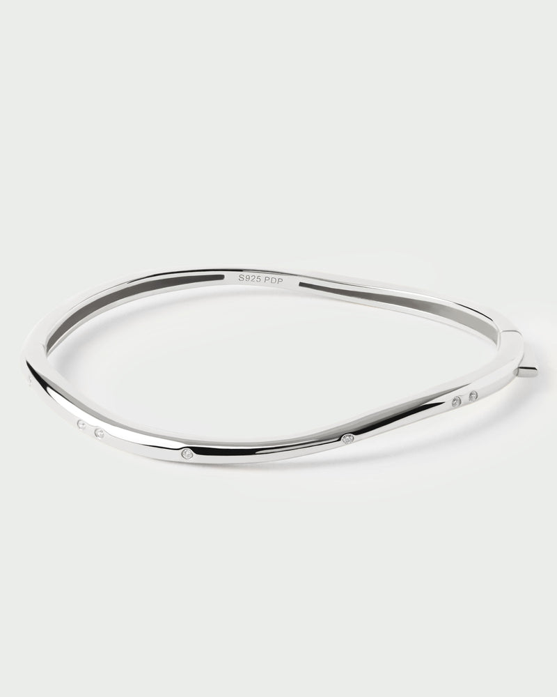 Sleek silver bangle bracelet set with sparkling zirconia and fluid lines