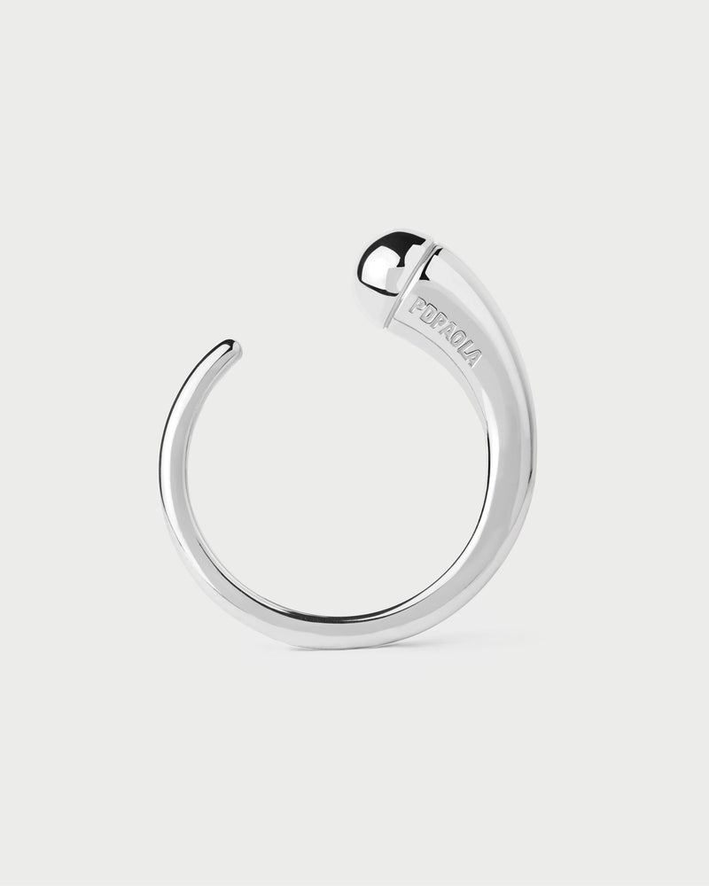 Sculptural open silver band ring with drop-shaped motif and rounded edges
