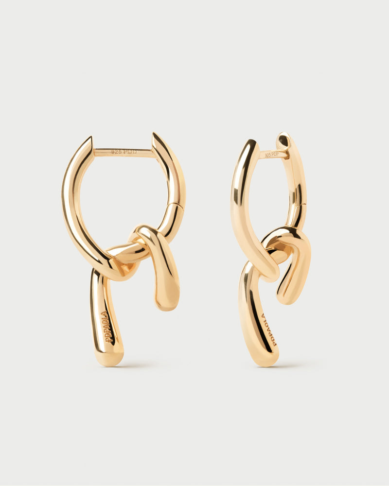 Small asymmetric hoop earrings with fluid knotted pendants