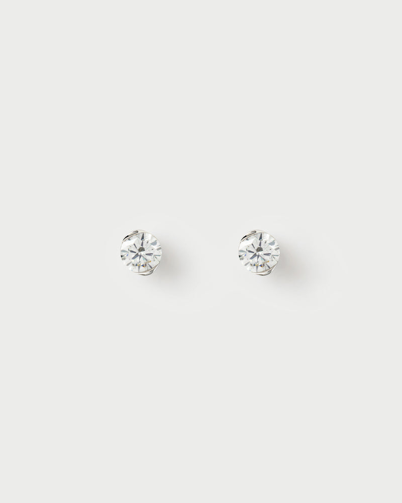 White gold diamond stud earrings with a round half-bezel lab-grown diamond
