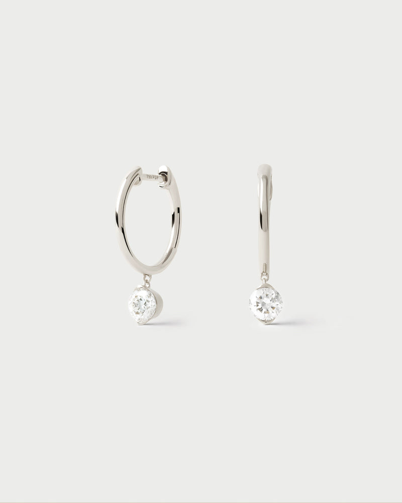 White gold hoop earrings with round lab-grown diamond pendant