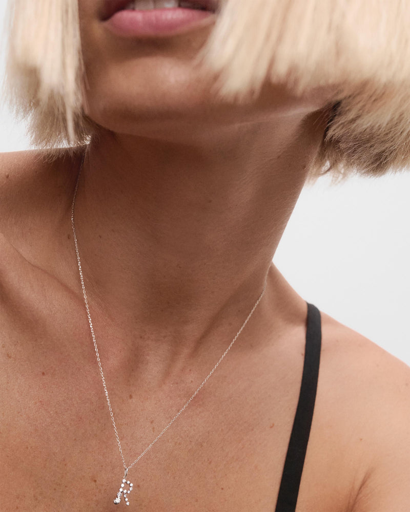 Diamonds and white gold R initial pendant - 
  
    18K White gold / Rhodium silver plating
  
