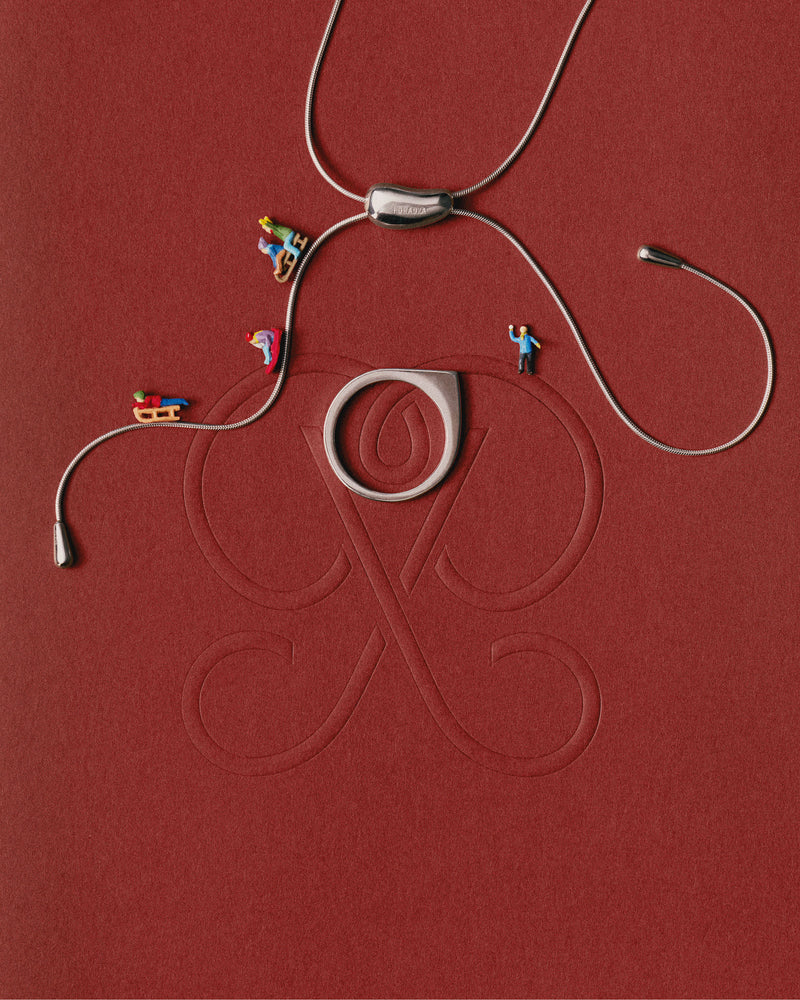 Silver geometric ring with asymmetric round shape