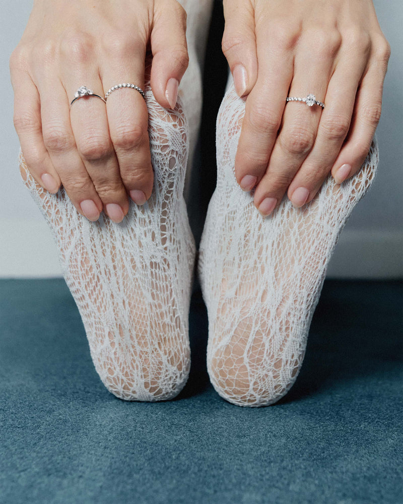 White gold eternity ring set with a row of large lab-grown diamonds